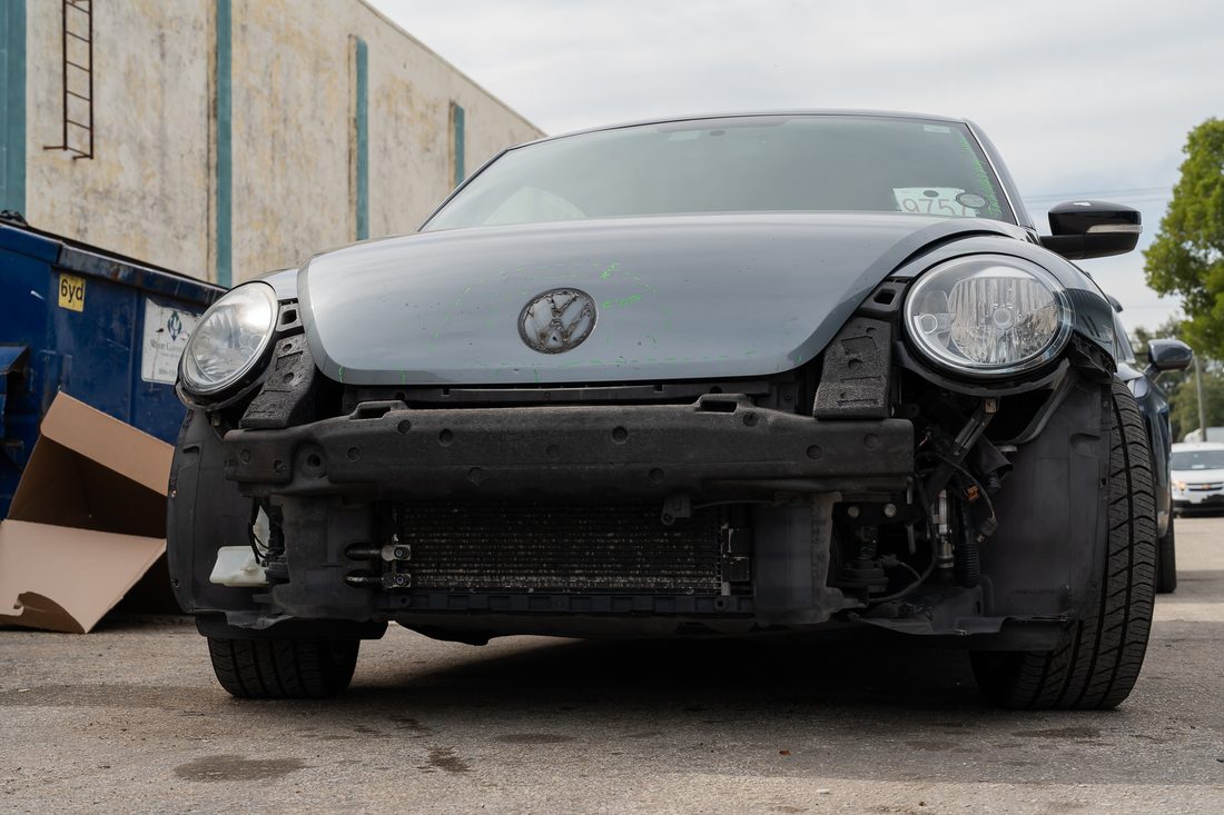 Front bumper cover and headlamp assembly removed from a Beetle