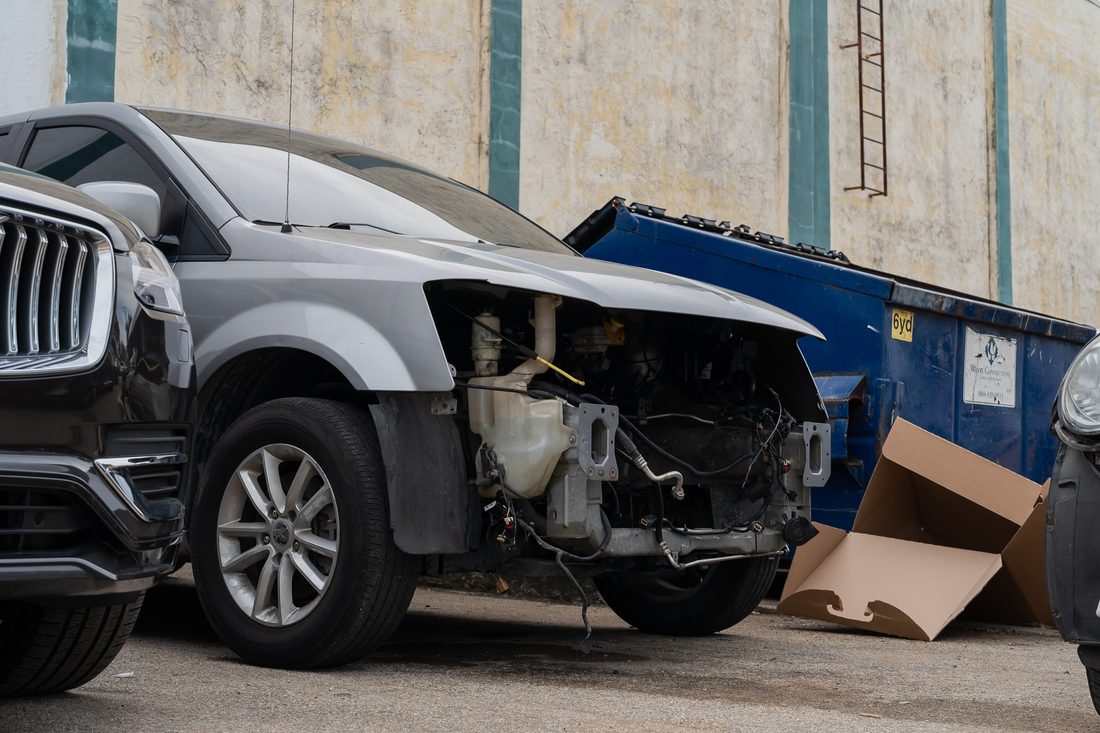Front-end collision damage on a full-size SUV before teardown
